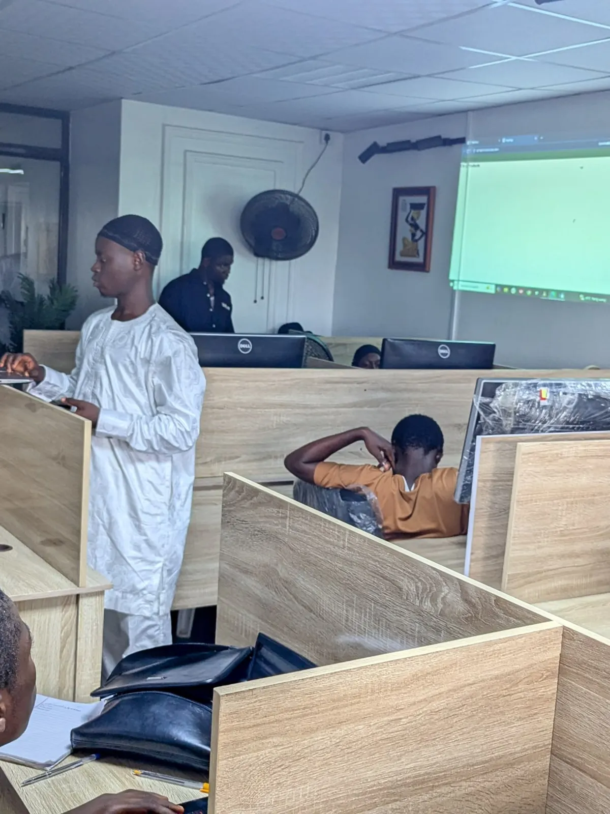 A session in progress with members at their desks