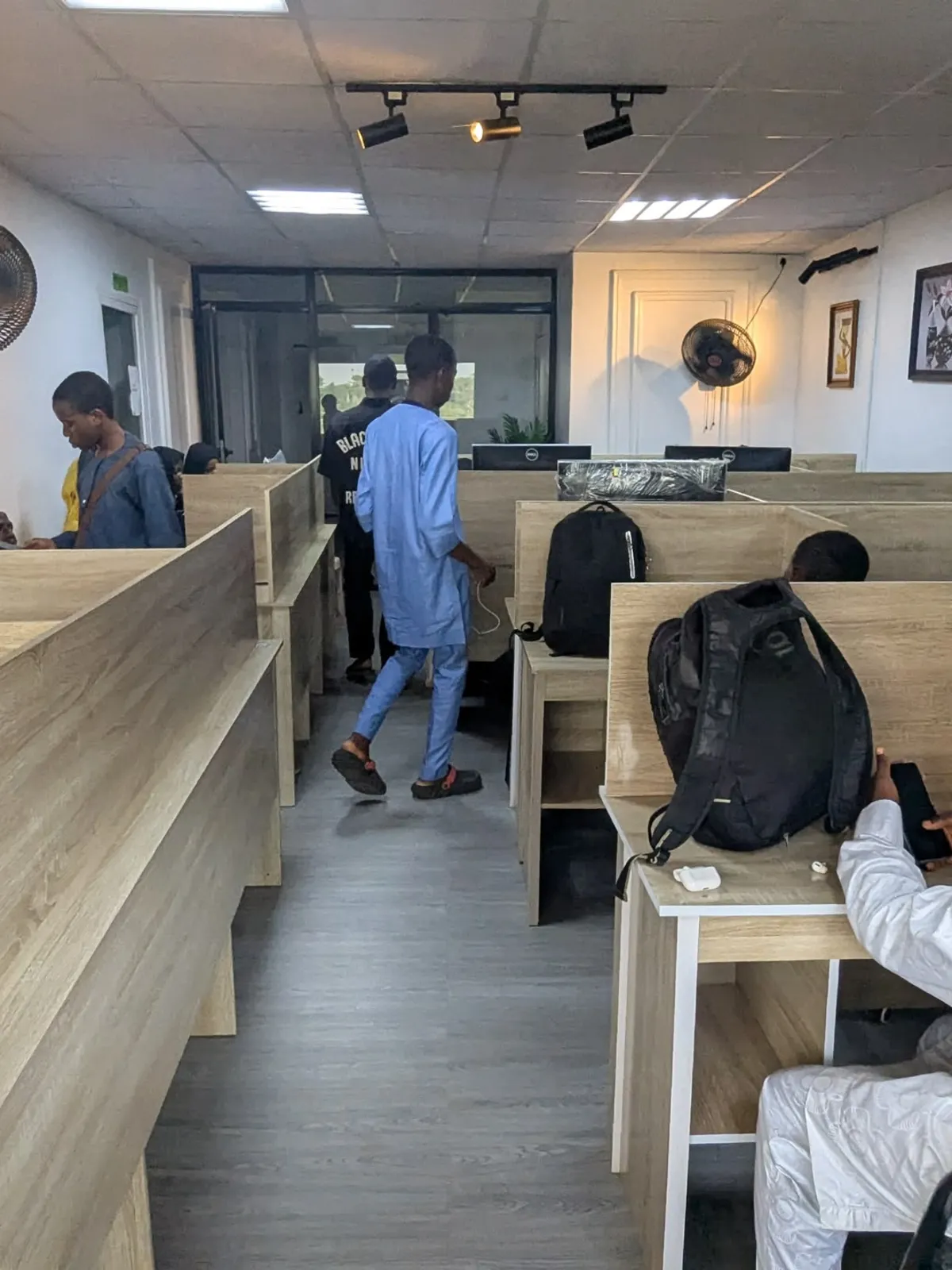 Members working at desks along the coworking floor